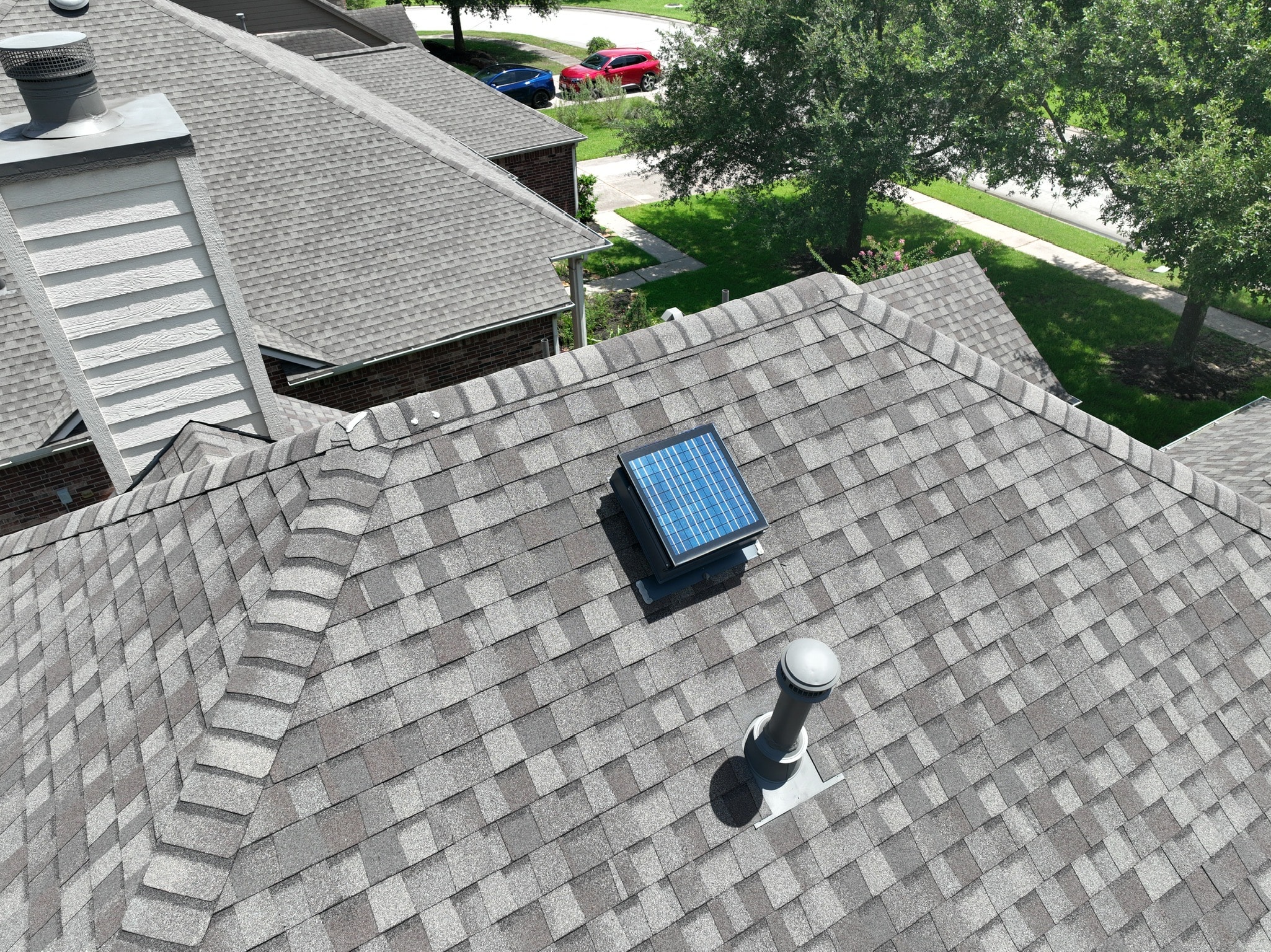 Solar powered roof vent installed on a residential roof